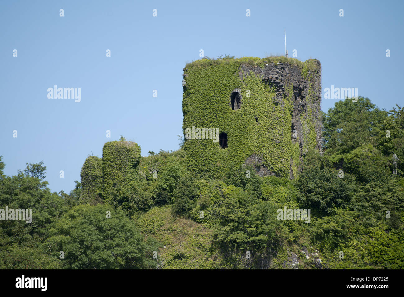 View of ivy covered castle ruins on hill in coastal bay Dunollie Castle near Oban Firth of Lorn Argyll and Bute Scotland July Stock Photo