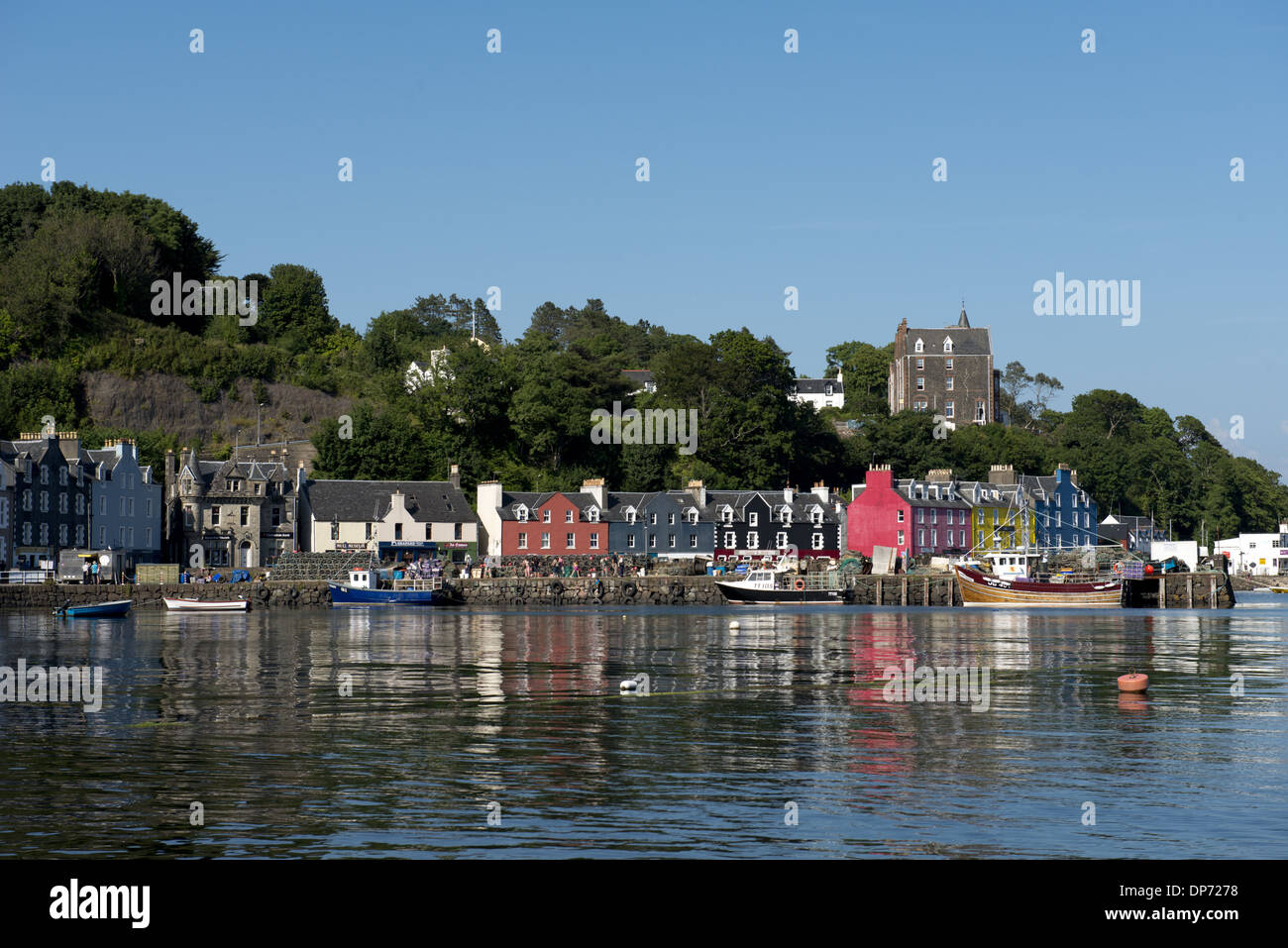 View of fishing boats at harbour of coastal town, Tobermory, Isle of Mull, Inner Hebrides, Scotland, July Stock Photo