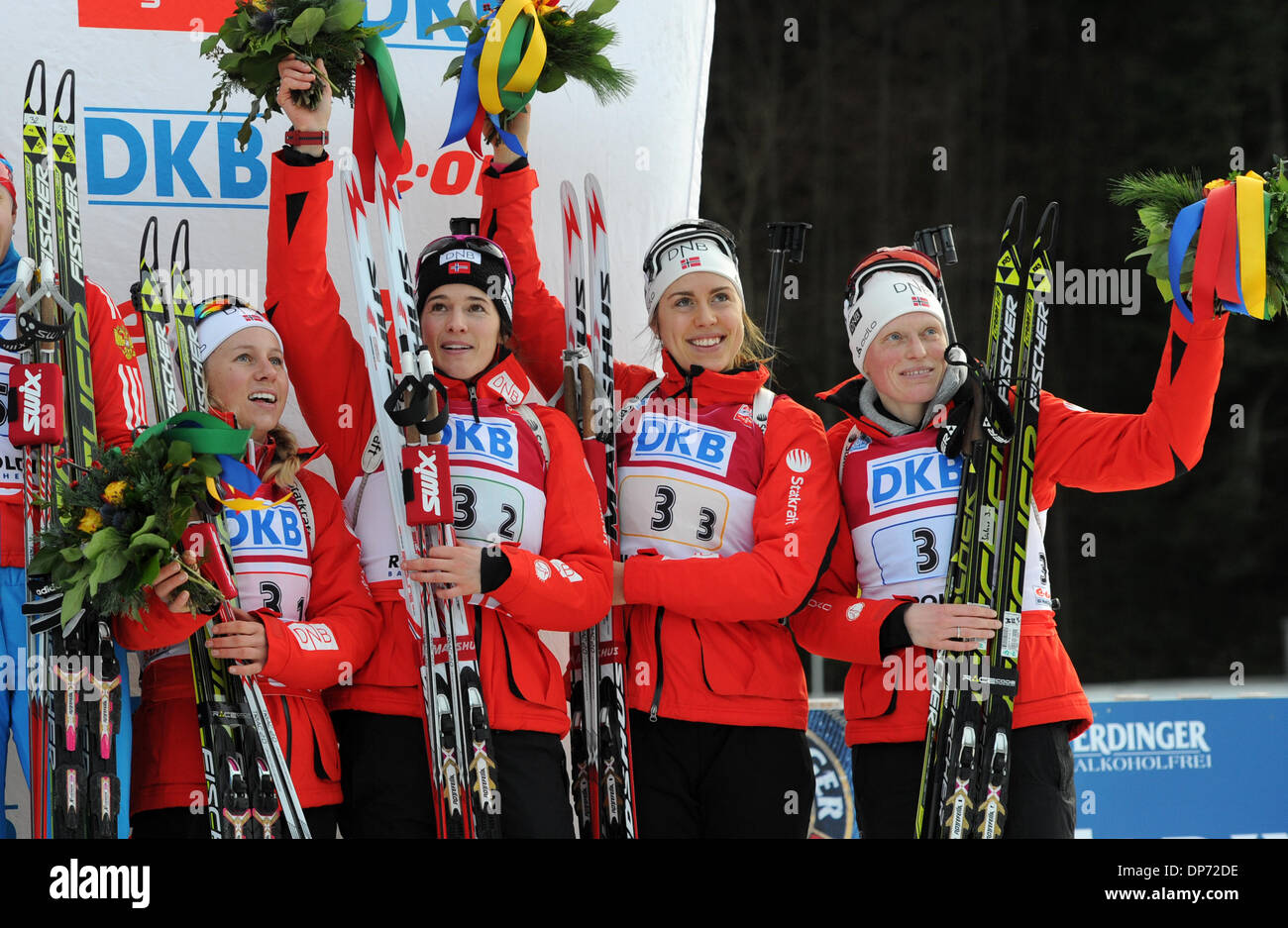 Ruhpolding, Germany. 08th Jan, 2014. Norway's Tiril Eckhoff (L-R), Ann Kristin Aafedt Flatland, Synnoeve Solemdal and Tora Bergerhold celebrate after taking the third place at the Women's 4x6 km relay competition during the Biathlon World Cup at the Chiemgau Arena in Ruhpolding, Germany, 08 January 2014. Photo: TOBIAS HASE/dpa/Alamy Live News Stock Photo