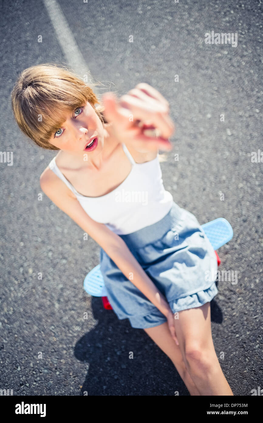 Trendy young woman pointing at camera Stock Photo - Alamy