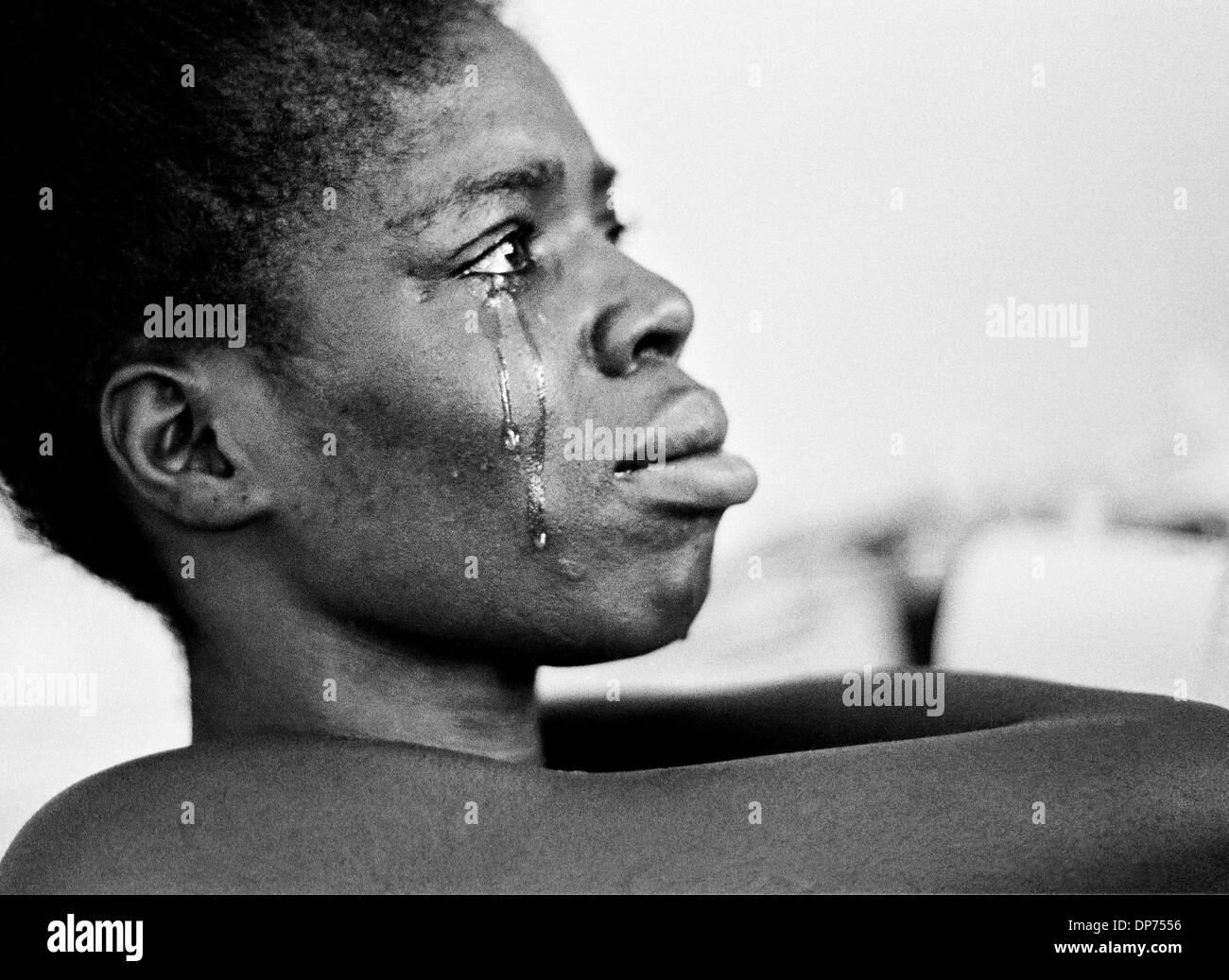 Jul 12, 2000; Kingston, JAMAICA; Despair - Ann Marie Young, 25, cries as she grapples with depression brought on by a gunshot wound during a robbery that left her a paraplegic, unable to care for herself or her two young children. After Young tried to commit suicide three times and her mother could no longer meet her serious medical needs, she was moved to the Golden Age Home in Ki Stock Photo