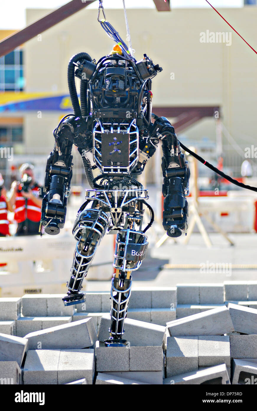 Ian, an Atlas robot with the IHMC Robotics team during the DARPA Rescue Robot Showdown at Homestead Miami Speedway December 20, 2013 in Homestead, FL. The DARPA event is to challenge teams to design robots that will conduct humanitarian, disaster relief and related operations. Stock Photo