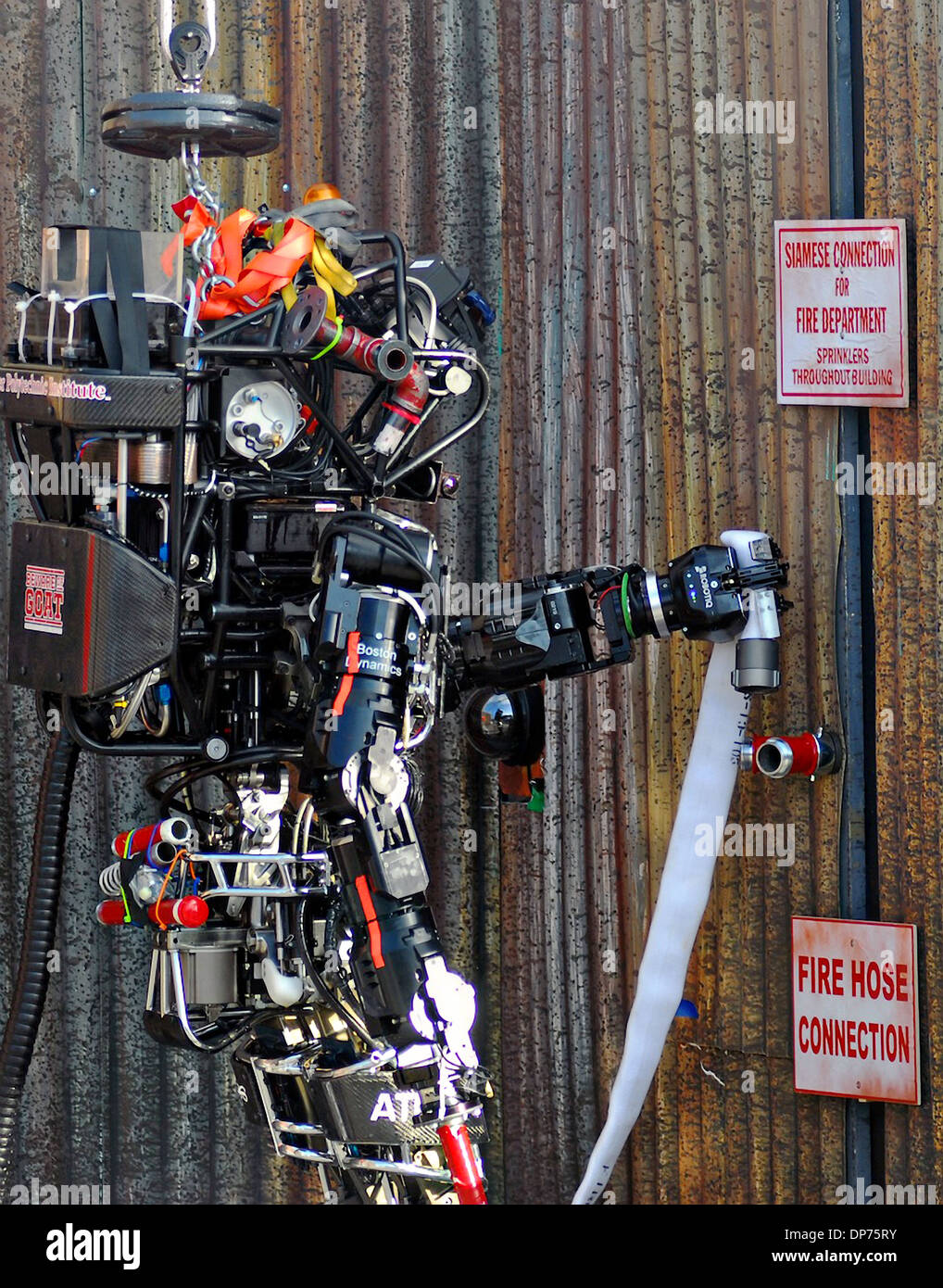 Boston Dynamic's Atlas robot during the DARPA Rescue Robot Showdown at Homestead Miami Speedway December 20, 2013 in Homestead, FL. The DARPA event is to challenge teams to design robots that will conduct humanitarian, disaster relief and related operations. Stock Photo