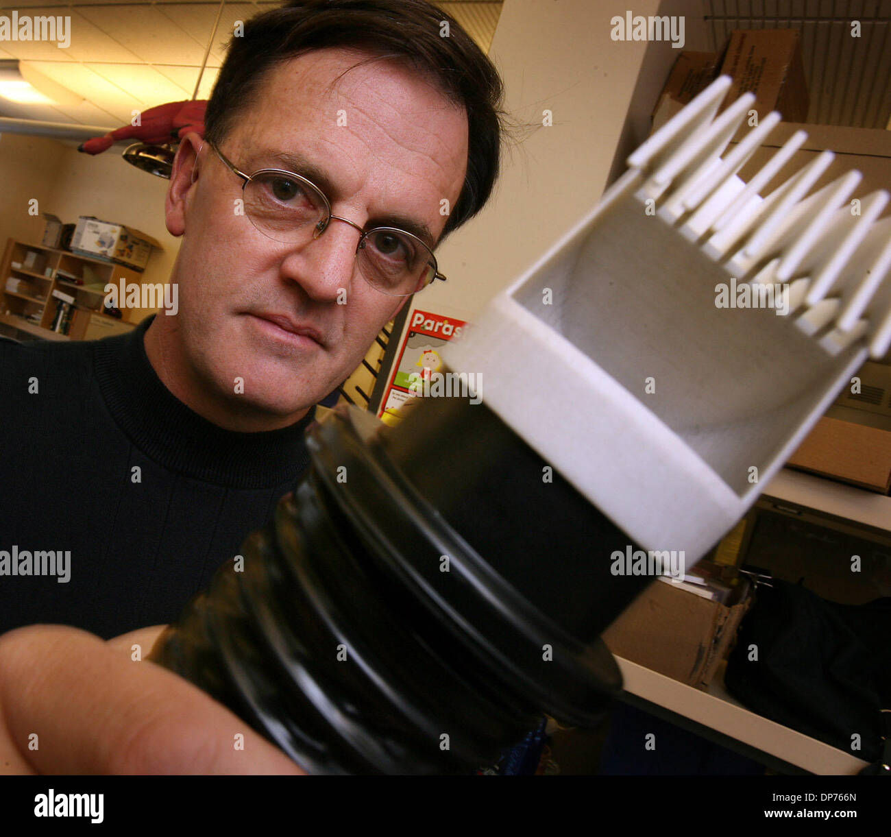 Nov 02, 2006 - Salt Lake City, Utah, USA - University of Utah researcher, DALE CLAYTON, has created a hairdryer-like device to kill lice, as opposed to the traditional shampoo treatment.   The head louse (Pediculus humanus capitis) is an obligate, ectoparasitic, wingless insect spending its entire life on human scalp and feeding exclusively on human blood. Humans are the only known Stock Photo