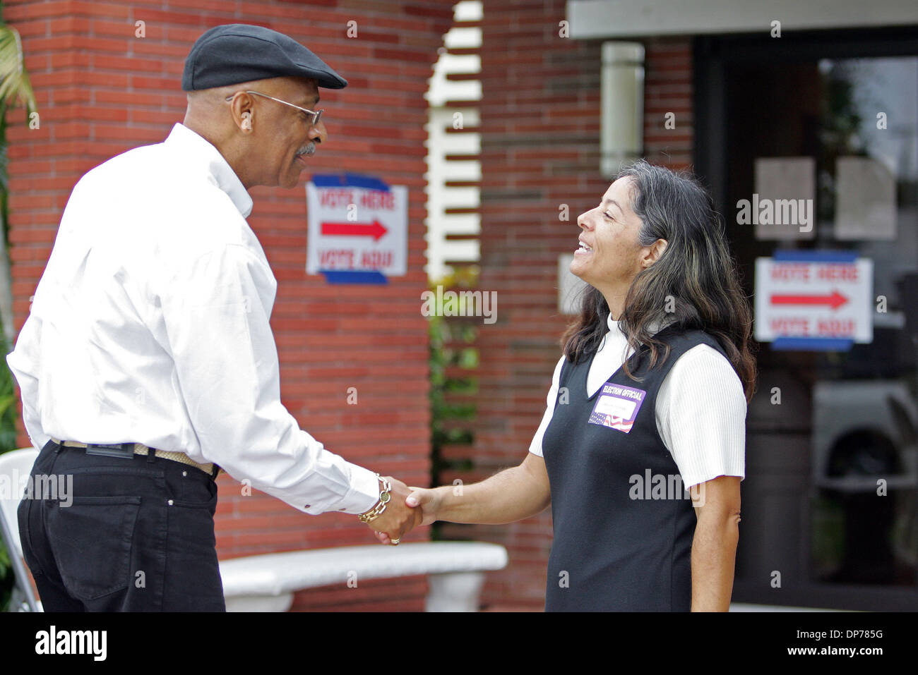 Nov 07, 2006; West Palm Beach, FL, USA; Supervisor of Elections Dr. Arthur Anderson shakes hands with precinct clerk Peggy Lopez outside Holy Spirit Episcopal Church precinct #2070 while checking on voting progress Tuesday morning. Mandatory Credit: Photo by Richard Graulich/Palm Beach Post/ZUMA Press. (©) Copyright 2006 by Palm Beach Post Stock Photo