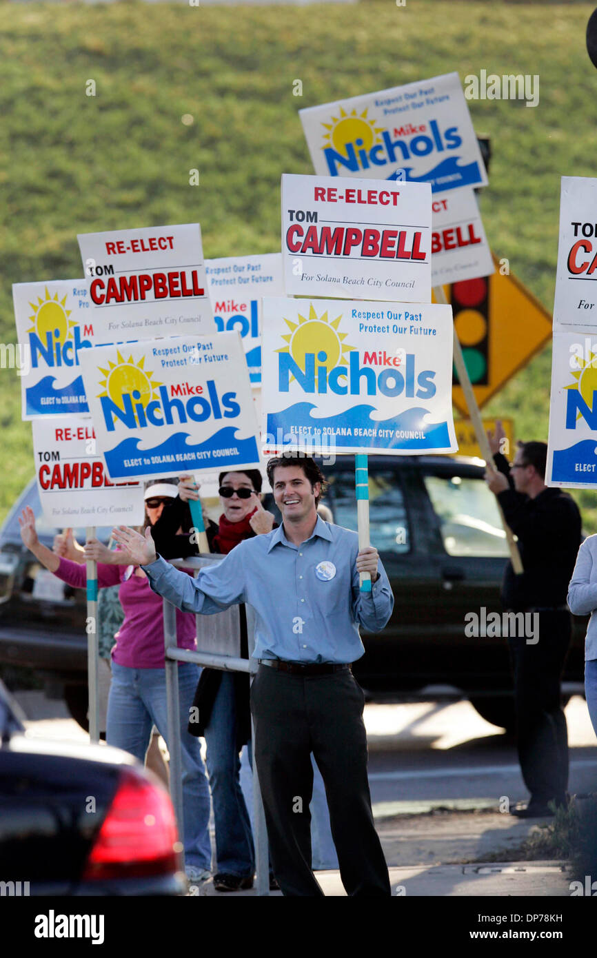 Nov 07, 2006; Solana Beach, CA, USA; Supporters of MIKE NICHOLS, DEANNE  BORER and TOM CAMPBELL wave election signs to drivers on Lomas Santa Fe  Drive as they drive onto the onramp
