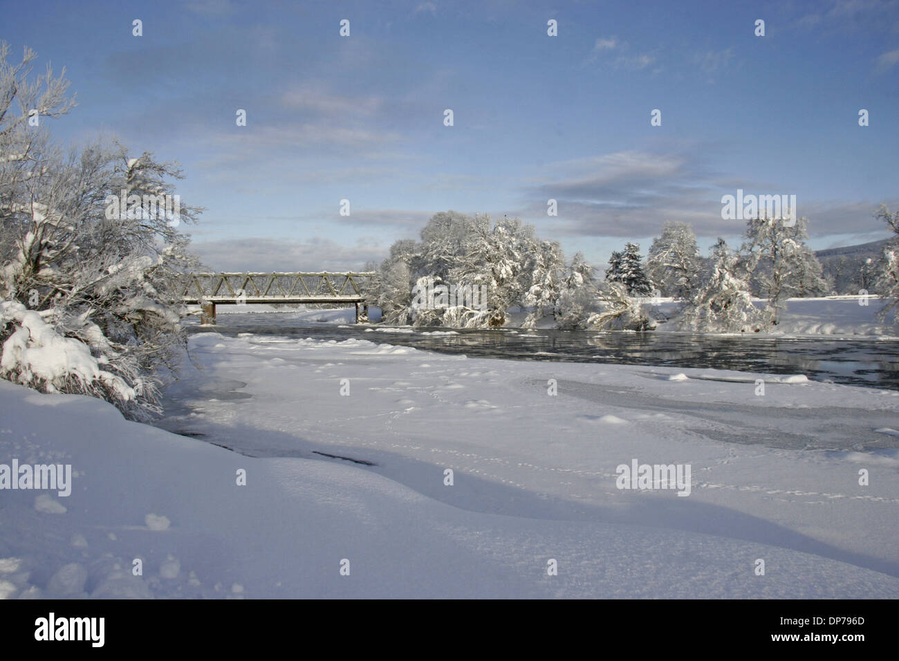 View of snow on ice covered river with European Otter (Lutra lutra) and Euopean Hare (Lepus europaeus) tracks River Spey Stock Photo