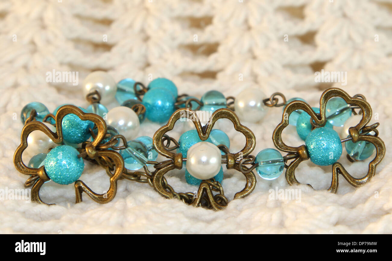 Hand made necklace on a knitted background Stock Photo