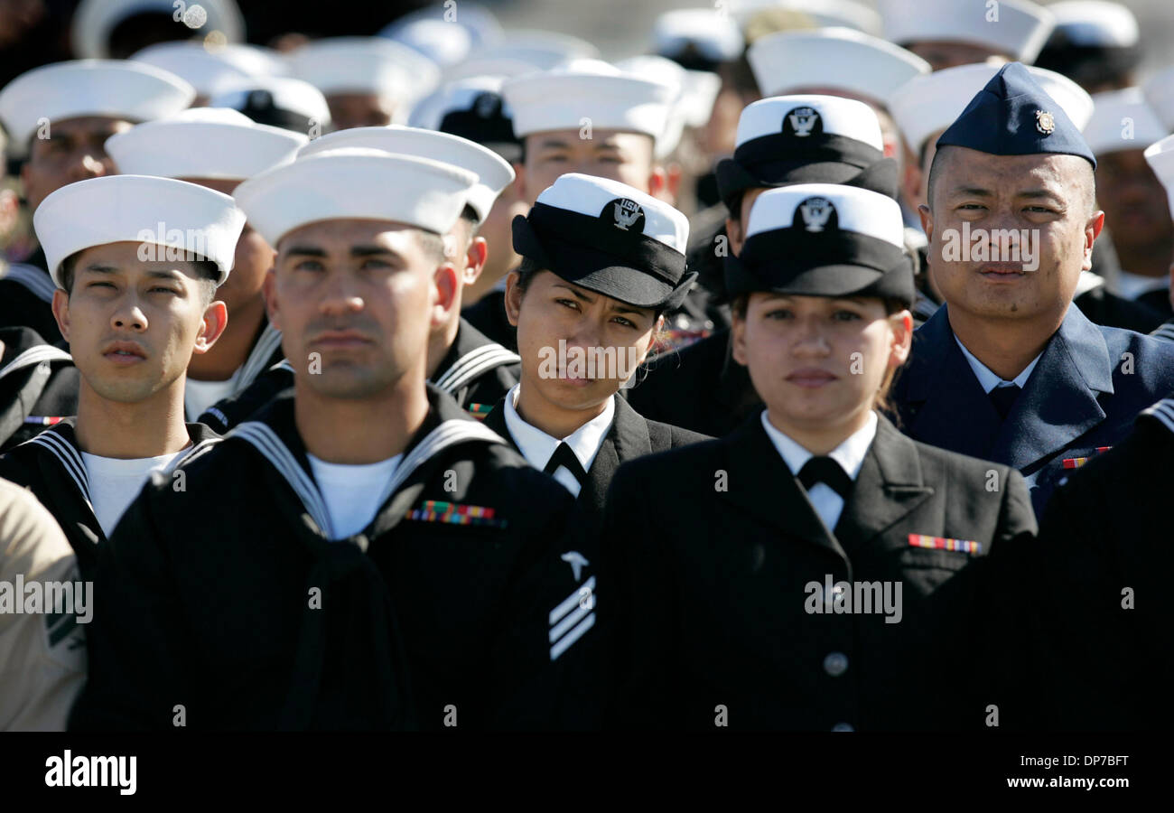 Nov 10, 2006; San Diego, CA, USA; Some of the 78 U. S. military service members from 21 countries that became U.S. Citizens in San Diego today, listen as Rear Admiral Jose Luis Betancourt, Ret. delivers the keynote address during their Naturalization ceremony on the flight deck of the U.S.S. Midway, the San Diego Aircraft Carrier Museum. Betancourt is also a naturalized citizen, ha Stock Photo