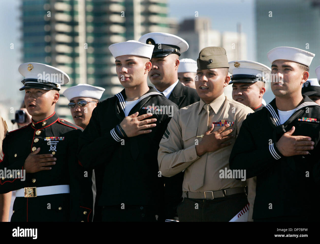 Nov 10, 2006; San Diego, CA, USA; Some of the 78 U. S. military service members from 21 countries that became U.S. Citizens in San Diego today, listen as Rear Admiral Jose Luis Betancourt, Ret. delivers the keynote address during their Naturalization ceremony on the flight deck of the U.S.S. Midway, the San Diego Aircraft Carrier Museum. Betancourt is also a naturalized citizen, ha Stock Photo