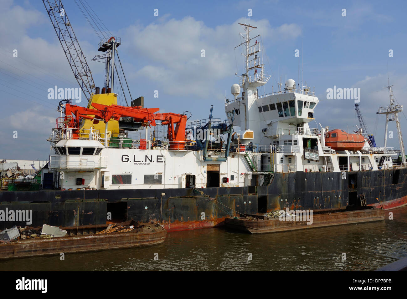 Old ship being dismantled to recycle scrap metal at Van Heyghen Recycling export terminal, port of Ghent, East Flanders, Belgium Stock Photo