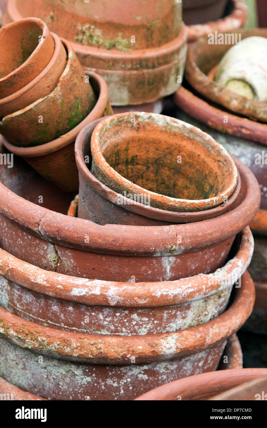 A stack of old terracotta flowerpots Stock Photo - Alamy