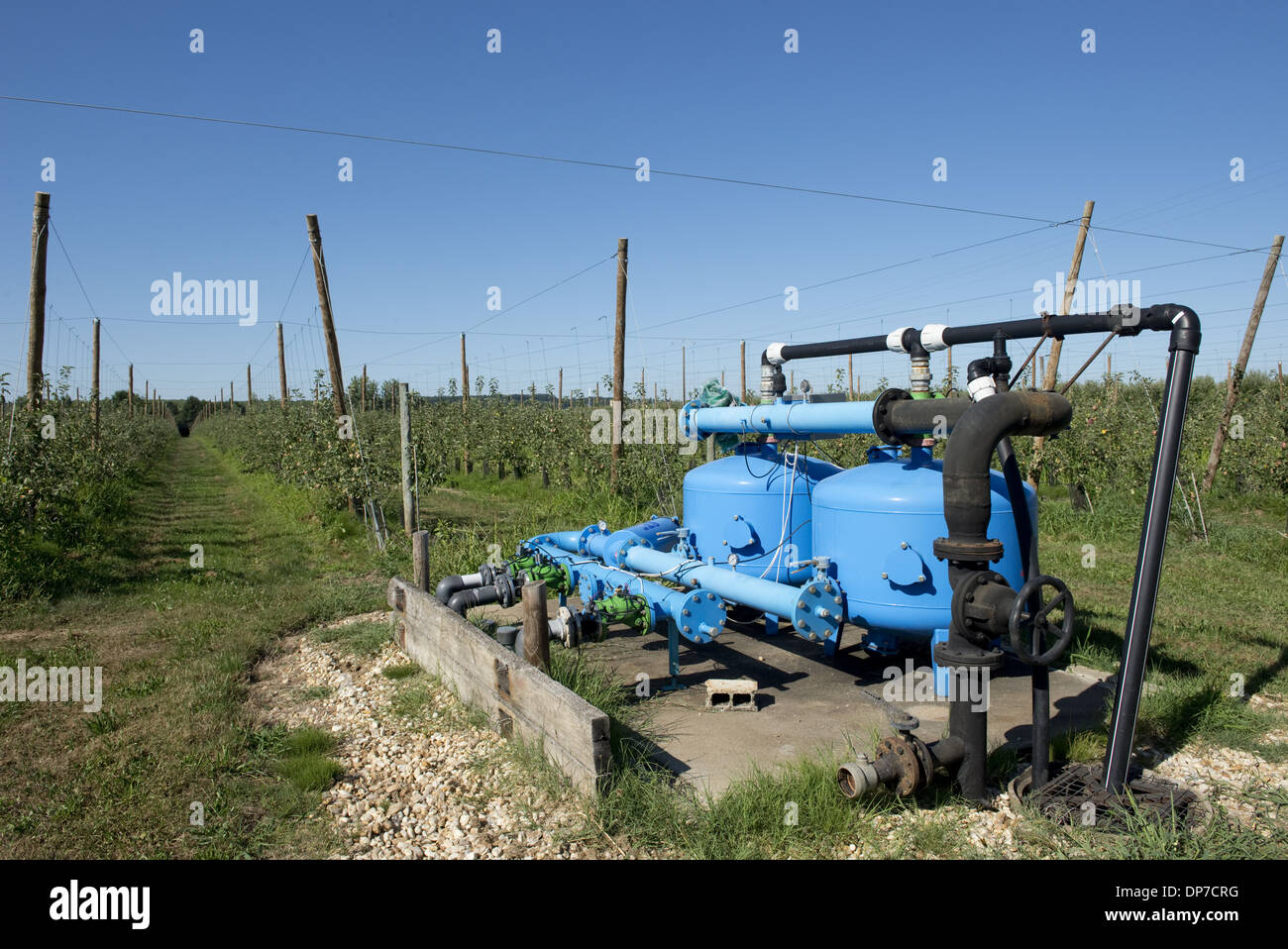 Irrigation and fertigation pump for cordon apple trees at Sainte-Foy-la-Grande, France Stock Photo