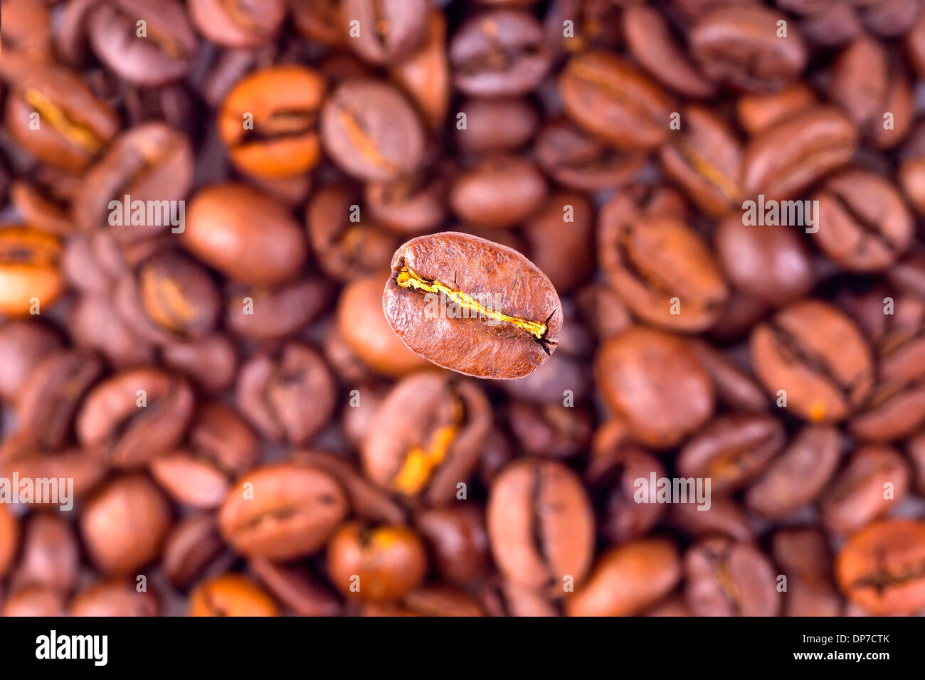Coffee bean on blurred beans background Stock Photo Alamy