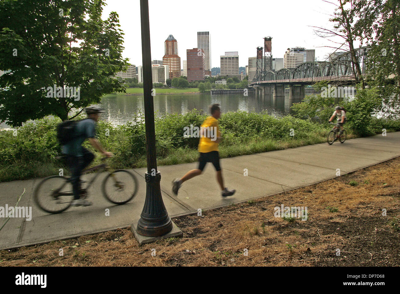 May 19, 2006 - Portland, Oregon, U.S. - Bikers and runners traverse the ...