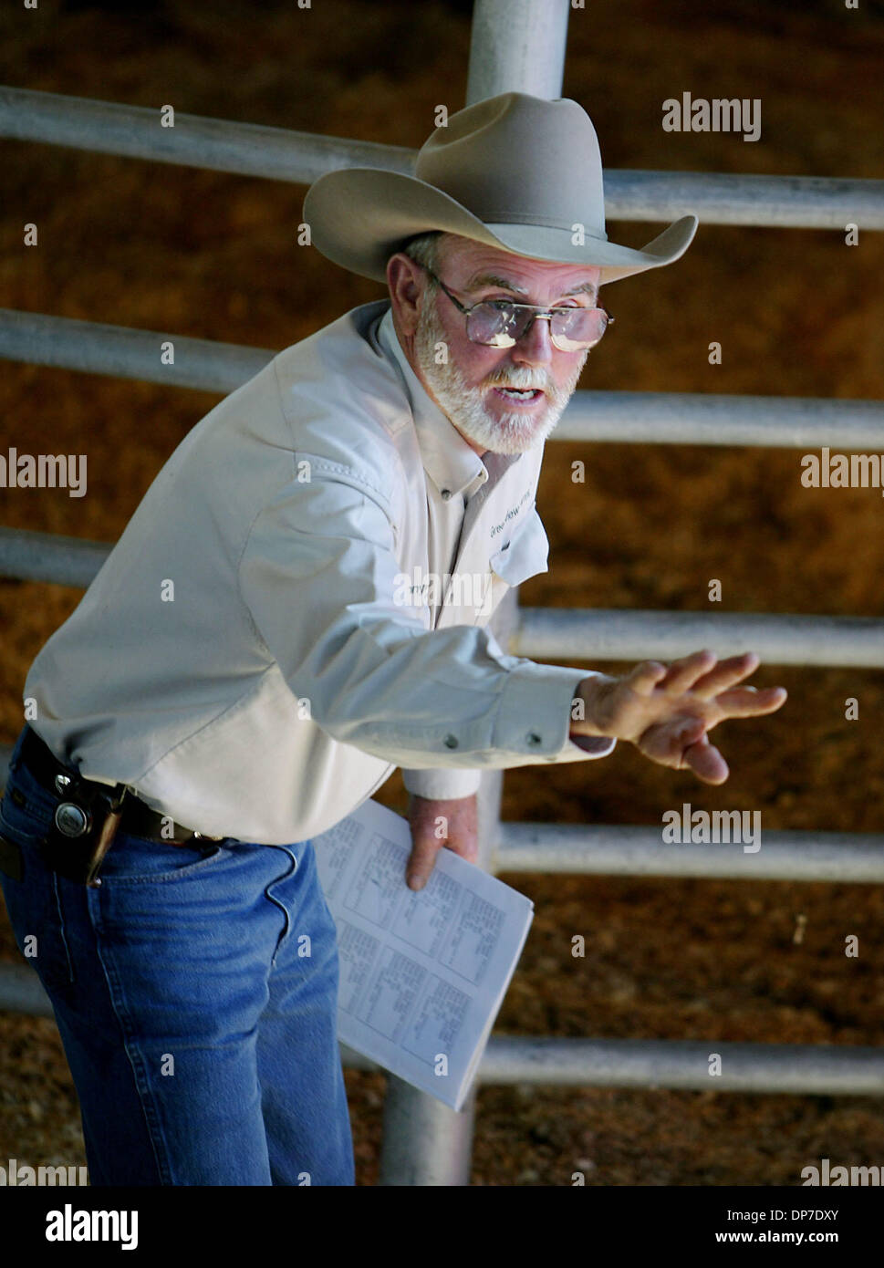 Nov 09, 2006; Ft. Pierce, FL, USA; Auction spotter Jonny Harris, of Georgia, calls out bids during the 28th annual Production Sale at Adams Ranch Thursday.  The ranch, owned by Alto 'Bud' Adams, Jr.,  provided a barbecue lunch to buyers and ranch employees before a horse and cattle auction in the ranch's pole barn. When the auction ended a very pleased Adams said, 'it was the best  Stock Photo