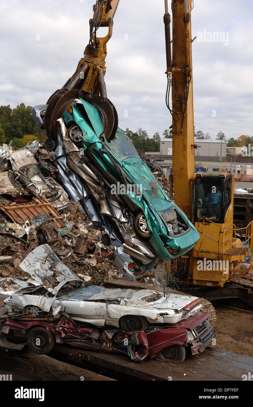 Nov 15, 2006; Atlanta, GA, USA; Crushed and stripped autos are readied for scrapping at scrap metal operation. Some larger peices of metal are cut down with cutting torches and then flattened by huge machines, then metal is recycled by being melted down for re-use. Mandatory Credit: Photo by Robin Nelson/ZUMA Press. (©) Copyright 2006 by Robin Nelson Stock Photo