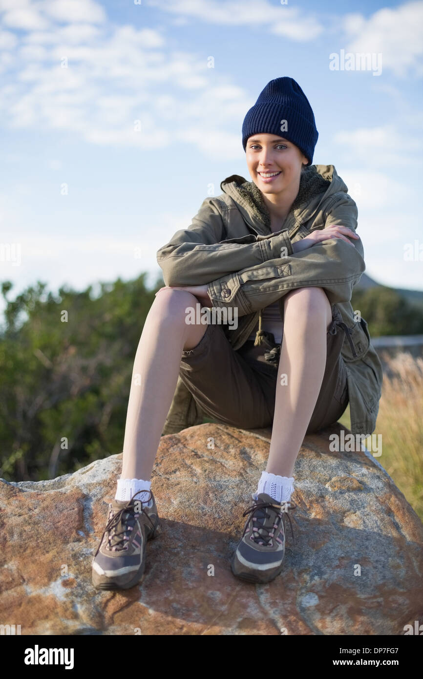 Beautiful woman sitting on rock hi-res stock photography and images - Alamy