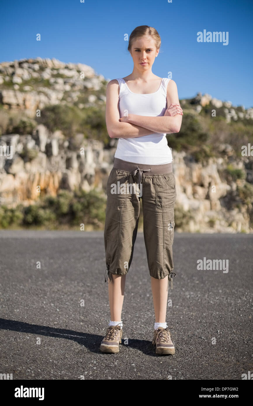 Woman crossing arms looking serious at camera Stock Photo