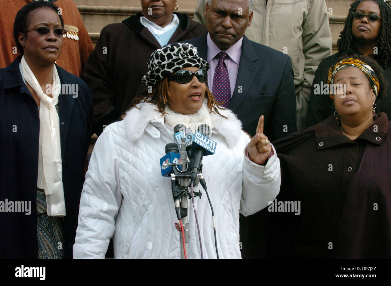 Nov 18, 2006; MANHATTAN, NEW YORK, USA; Jean Corbett Parker (L), of Harlem whose son Latran Parker was 26 when he was shot and killed in 2001 at the corner of 131st Street and 7th Avenue looks on as Jackie Rowe-Adams, (C) of Harlem discusses the separate shooting deaths of her sons Anthony Bouldin, 17 at the time and killed at 122nd and 7th Avenue and Tyrone Bouldin, 28 at the time Stock Photo