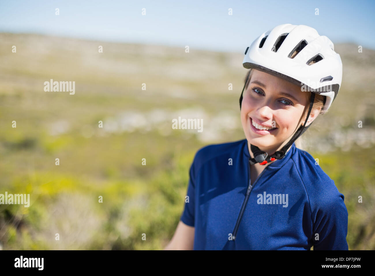 Smiling young woman wearing helmet hi-res stock photography and images ...