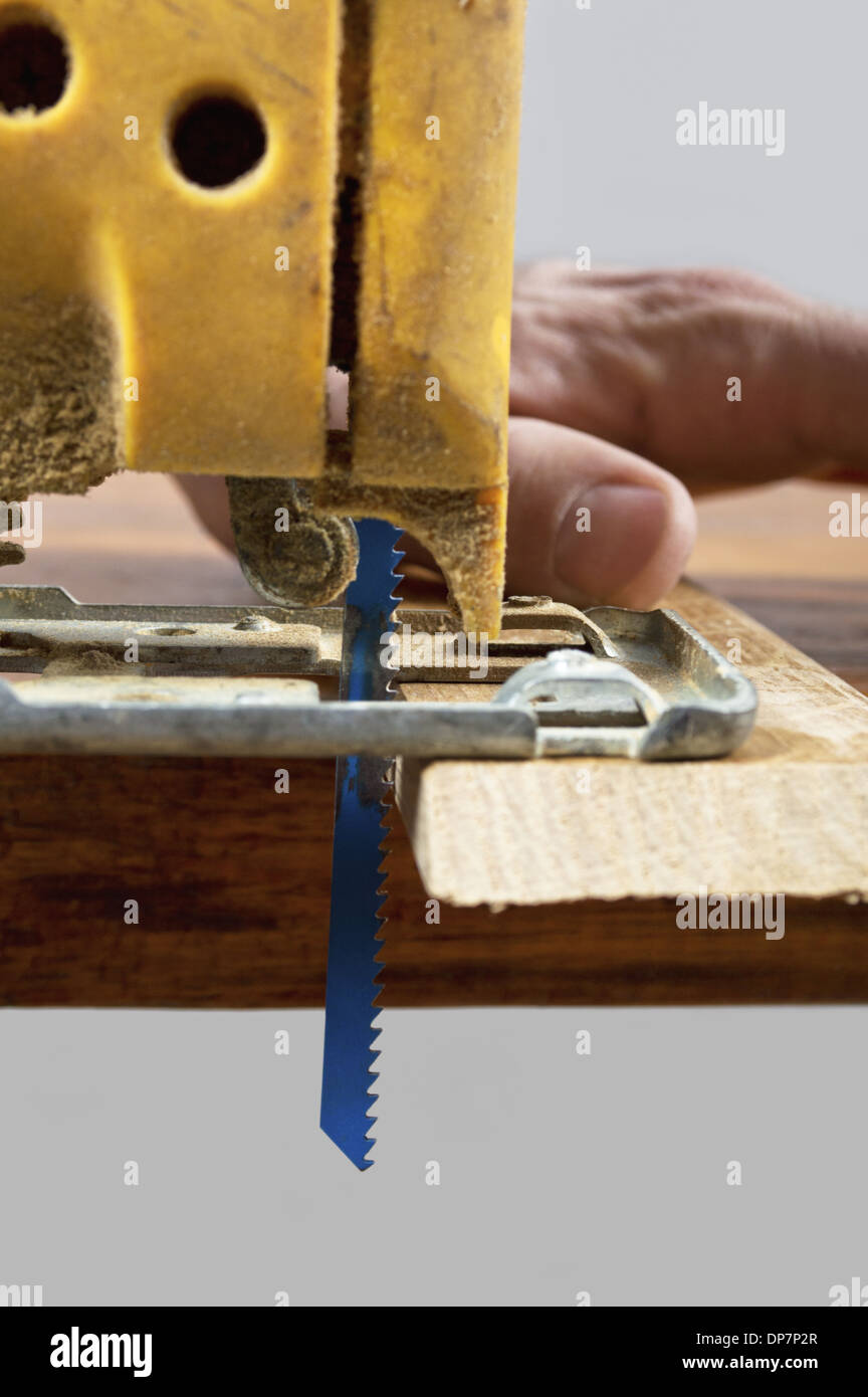 Carpenter using a electric saw Stock Photo