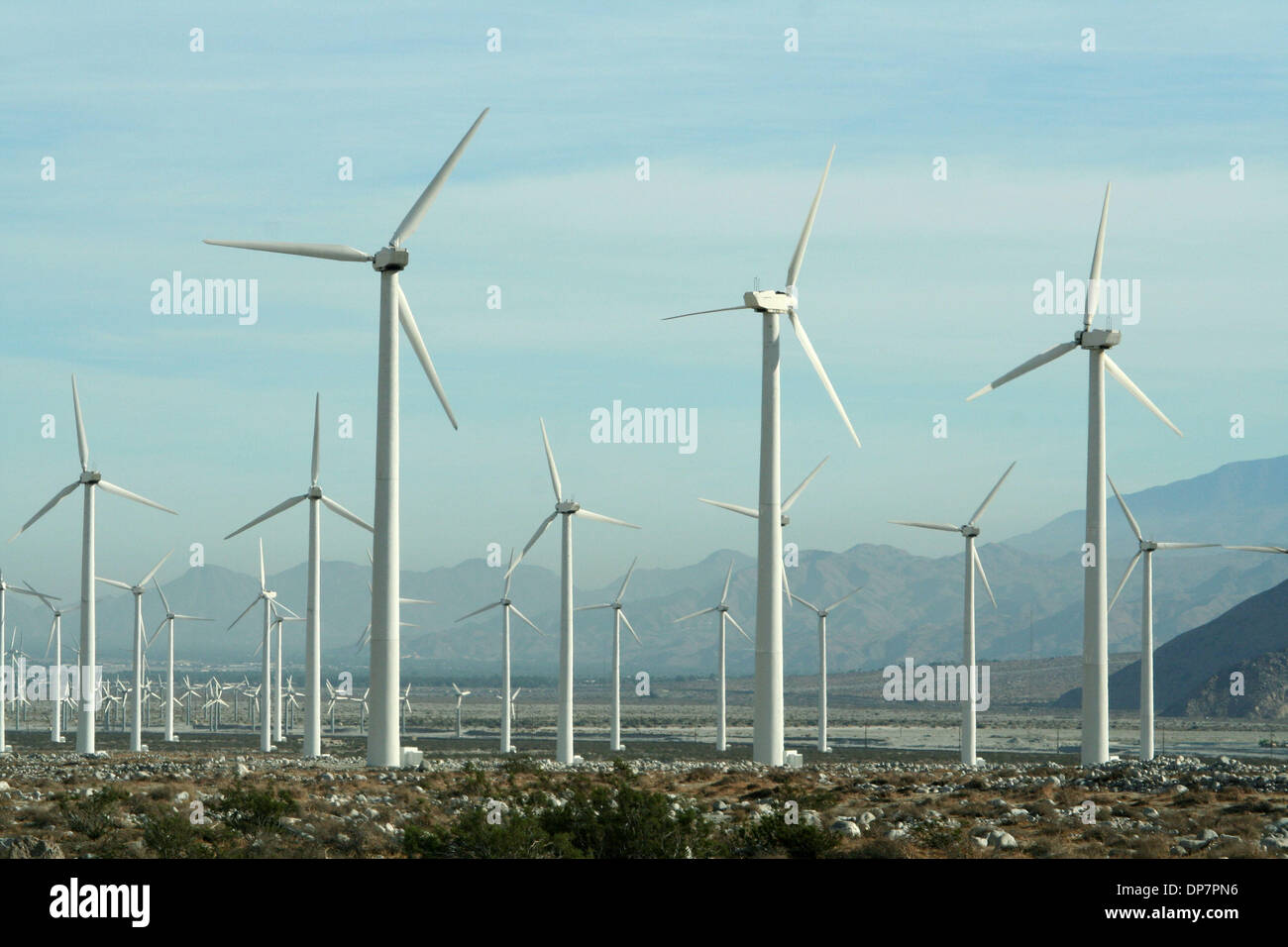 Nov 26, 2006; Cabazon, CA, USA; Turbines generate power in San Gorgonio near Palm Spring California. Wind power is the kinetic energy of wind, or the extraction of this energy by wind turbines. In 2004, wind power became the least expensive form of new power generation, dipping below the cost per kilowatt-hour of coal-fired plants. Wind power is growing faster than any other form o Stock Photo