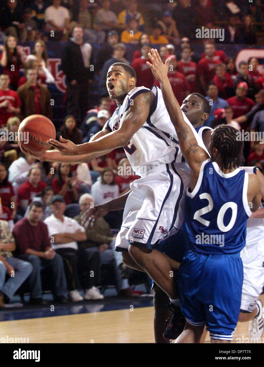 Nov 29, 2006; Moraga, CA, USA; High School Basketball: St. Mary's guard JOHN WINSTON gets fouled as he goes up for a shot by San Jose State's KEVIN BUGGS, right, in the first half of their game at St. Mary's College in Moraga. St Mary's Gaels beat San Jose Spartans 78-60. Mandatory Credit: Photo by Nader Khouri/Contra Costa Times/ZUMA Press. (©) Copyright 2006 by Contra Costa Times Stock Photo