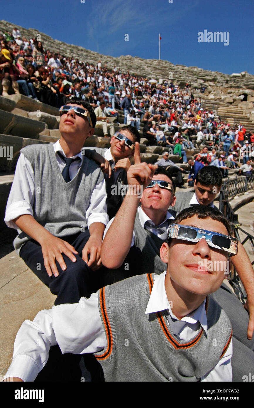 Mar 29, 2006; Side, Turkey; Turkish middle school students view stages of the full solar eclipse in the Mediterranean city of Side Turkey, Wednesday March 29 2006. The total eclipse was visible in a narrow band from Brazil across the Atlantic to Northern Mongolia. In a total eclipse, the entire sun is blocked by the moon, creating a massive shadow on Earth. The next total solar ecl Stock Photo