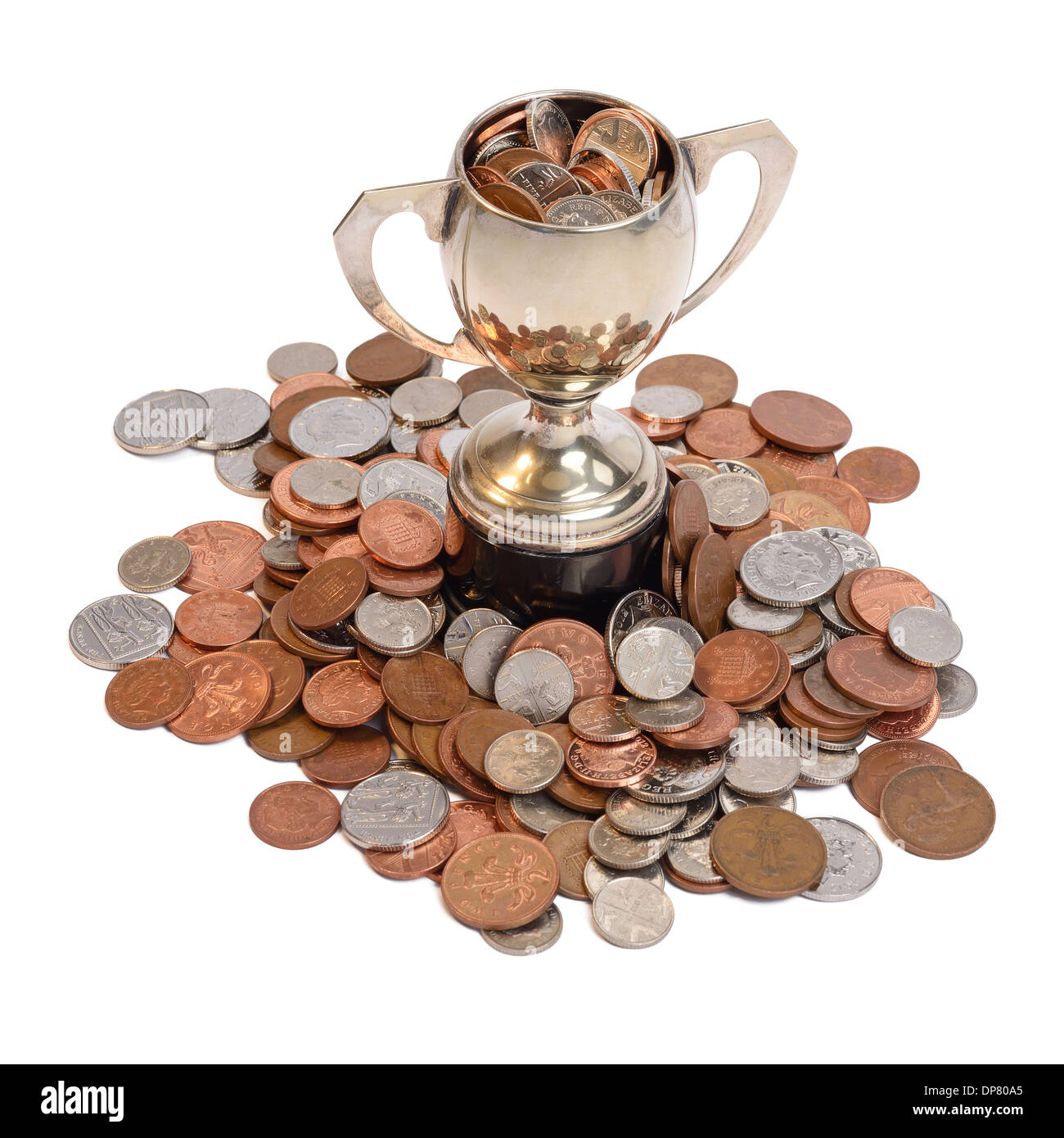 Silver trophy in the middle of a pile of coins Stock Photo