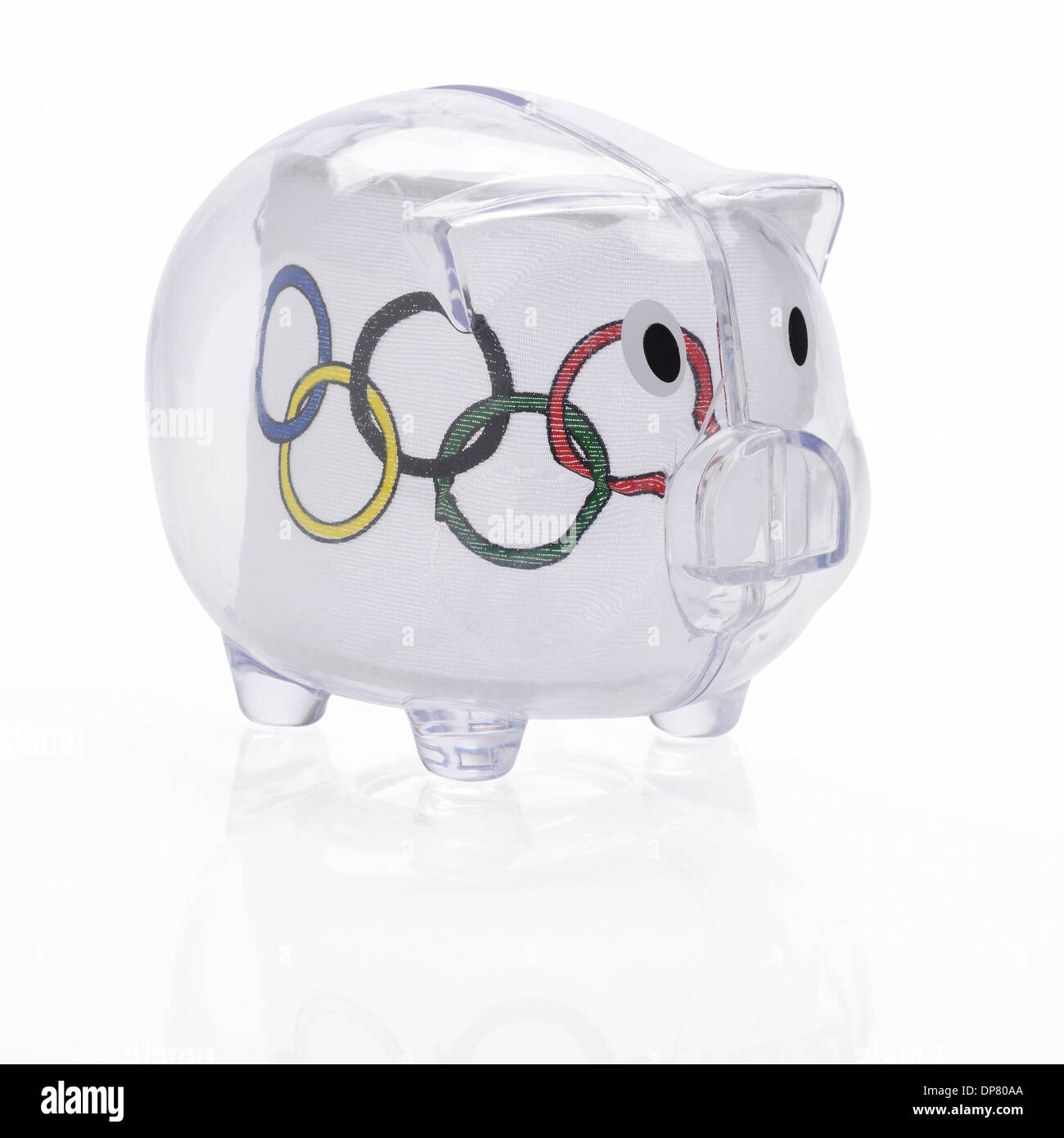 Olympic flag inside a clear plastic piggy bank Stock Photo