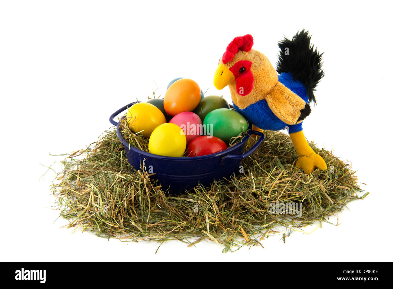 Blue bucket with straw and colorful painted easter eggs with chicken Stock Photo