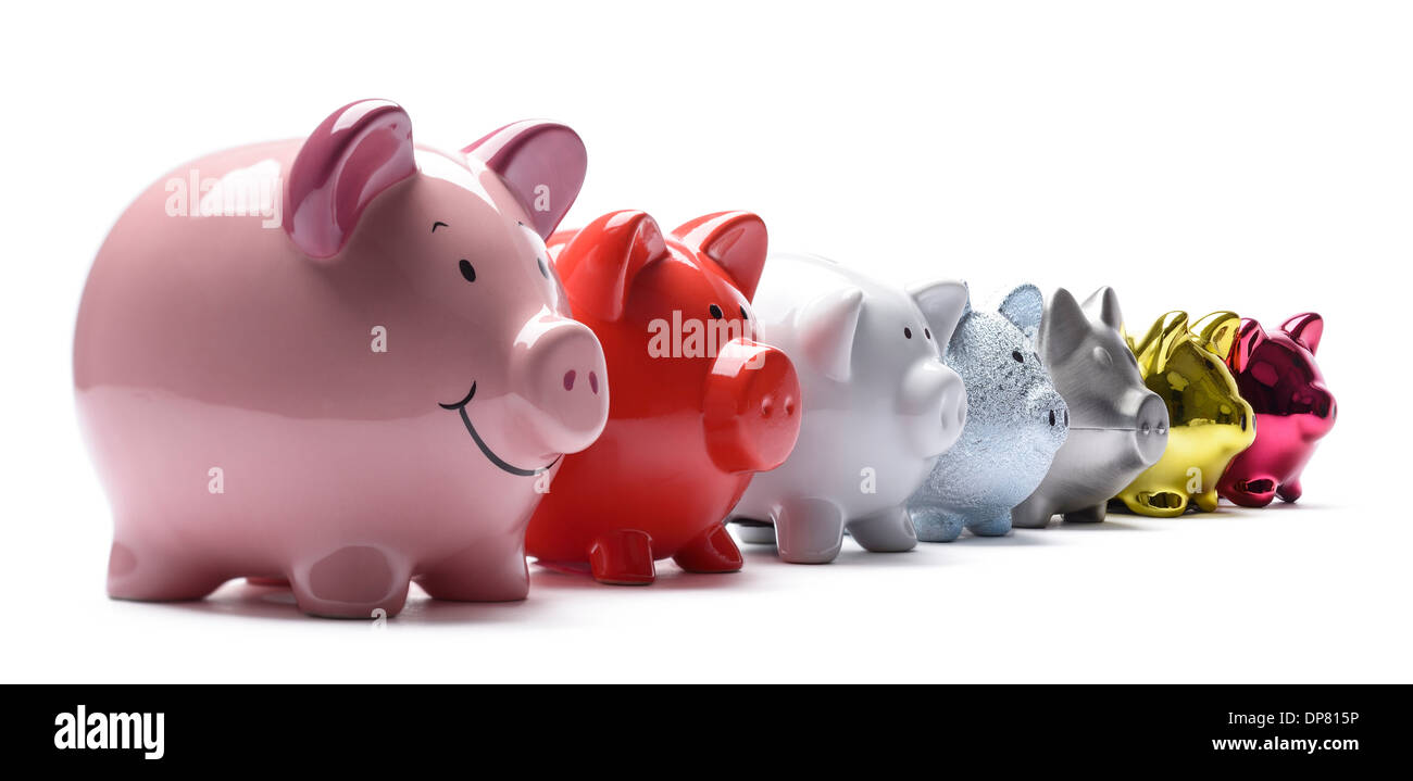 Seven different piggy banks in a line Stock Photo