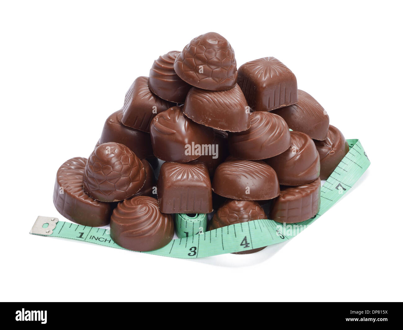 Pile of chocolates and a measuring tape Stock Photo