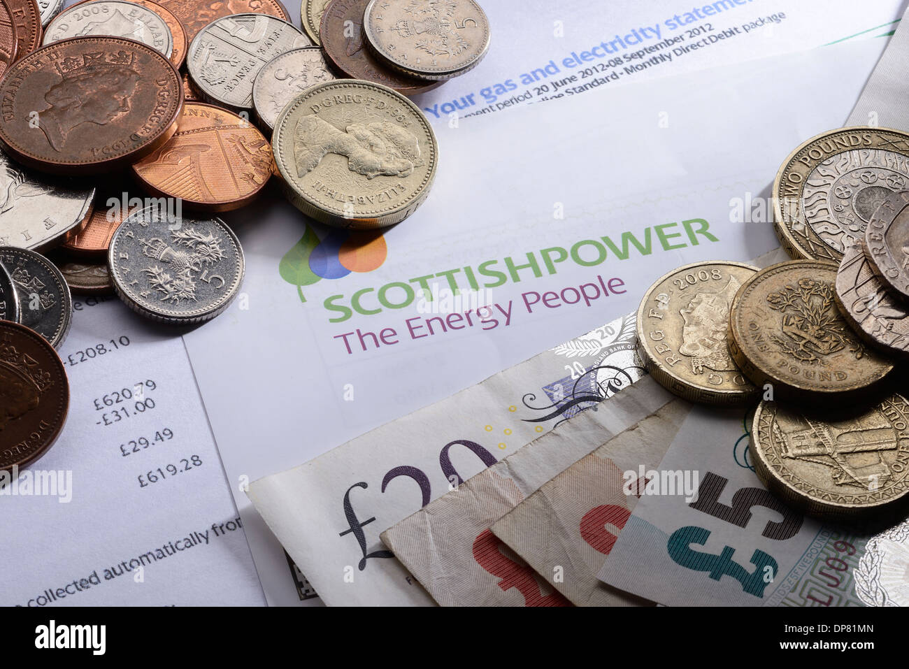 Scottish Power energy bill with coins and money Stock Photo
