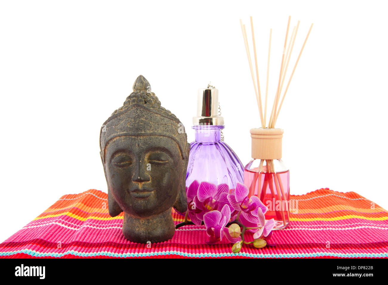 Tropical pink orchid with Buddha and scented sticks Stock Photo