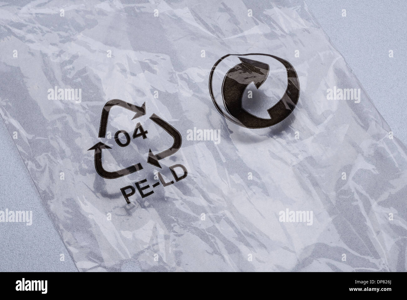 Piece of polythene with a recycling logo printed onto the surface Stock Photo