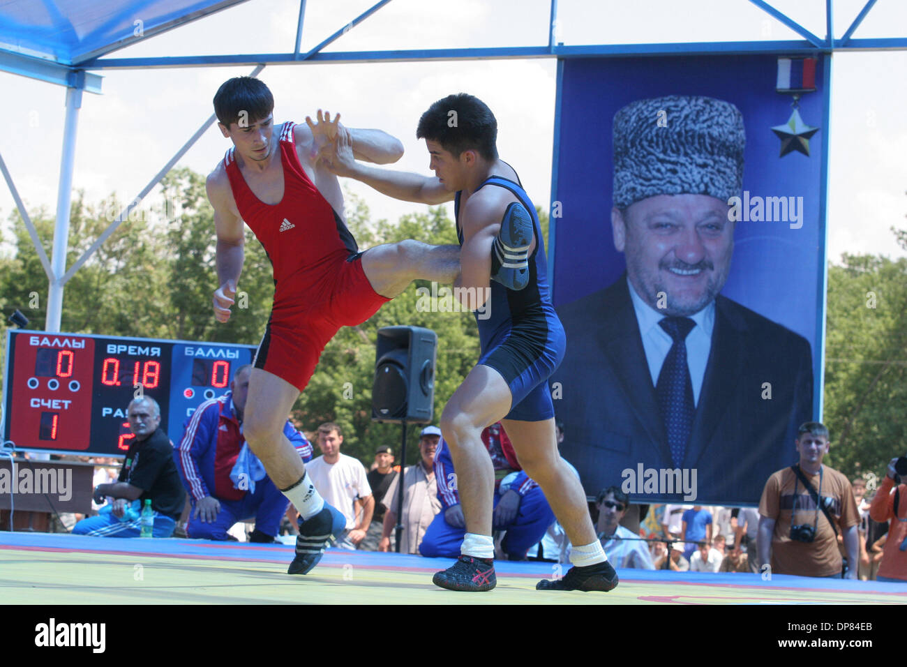Chechen-Russian and  U.S. wrestlers took part Tuesday in a match in the war-ravaged republic of Chechnya, part of authorities` efforts to show normal life is returning.Chechnyan wrestler Beckhan Goigereev is fighting vs US wrestler.Portrait of Akhmat-Hadzhi Kadyrov is in the backgroud.(Credit Image: © PhotoXpress/ZUMA Press) RESTRICTIONS: North and South America Rights ONLY! Stock Photo