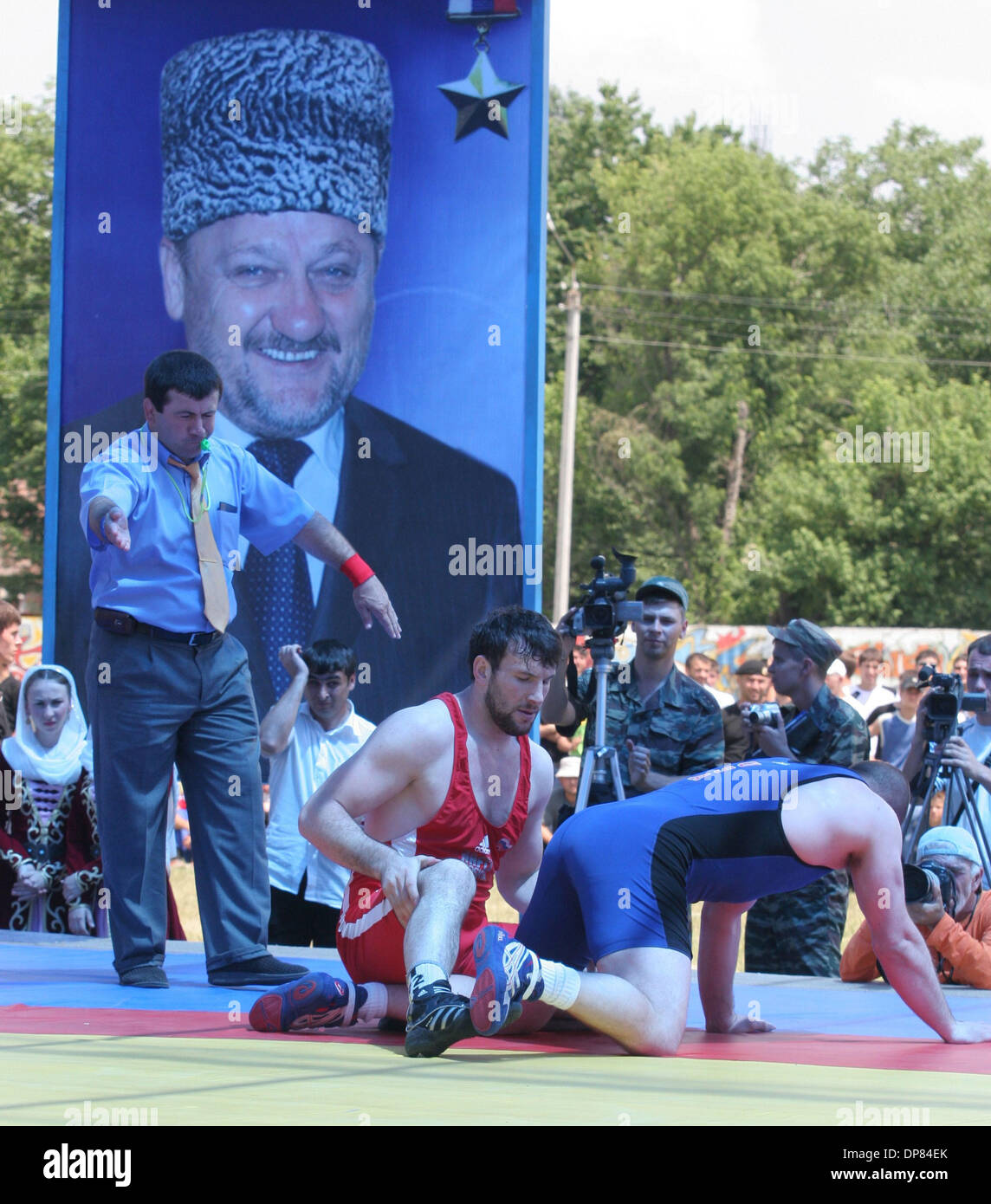 Chechen-Russian and  U.S. wrestlers took part Tuesday in a match in the war-ravaged republic of Chechnya, part of authorities` efforts to show normal life is returning.Chechnyan wrestler Ali Agayev is fighting vs US wrestler.Portrait of Akhmat-Hadzhi Kadyrov is in the backgroud.(Credit Image: © PhotoXpress/ZUMA Press) RESTRICTIONS: North and South America Rights ONLY! Stock Photo