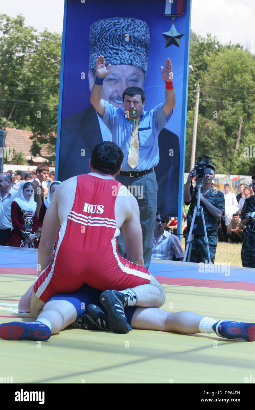Chechen-Russian and  U.S. wrestlers took part Tuesday in a match in the war-ravaged republic of Chechnya, part of authorities` efforts to show normal life is returning.Chechnyan wrestler Ali Agayev is fighting vs US wrestler.Portrait of Akhmat-Hadzhi Kadyrov is in the backgroud.(Credit Image: © PhotoXpress/ZUMA Press) RESTRICTIONS: North and South America Rights ONLY! Stock Photo