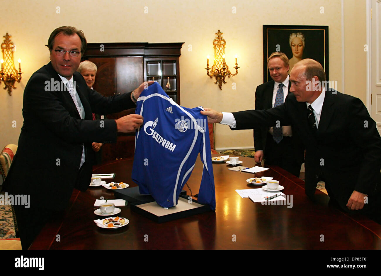Vladimir Putin in Germany was presented a football T-shirt of Schalke-04 FC with Gazprom logo on it (Gazprom is a sponsor of Schalke FC). (Credit Image: © PhotoXpress/ZUMA Press) RESTRICTIONS: North and South America Rights ONLY! Stock Photo