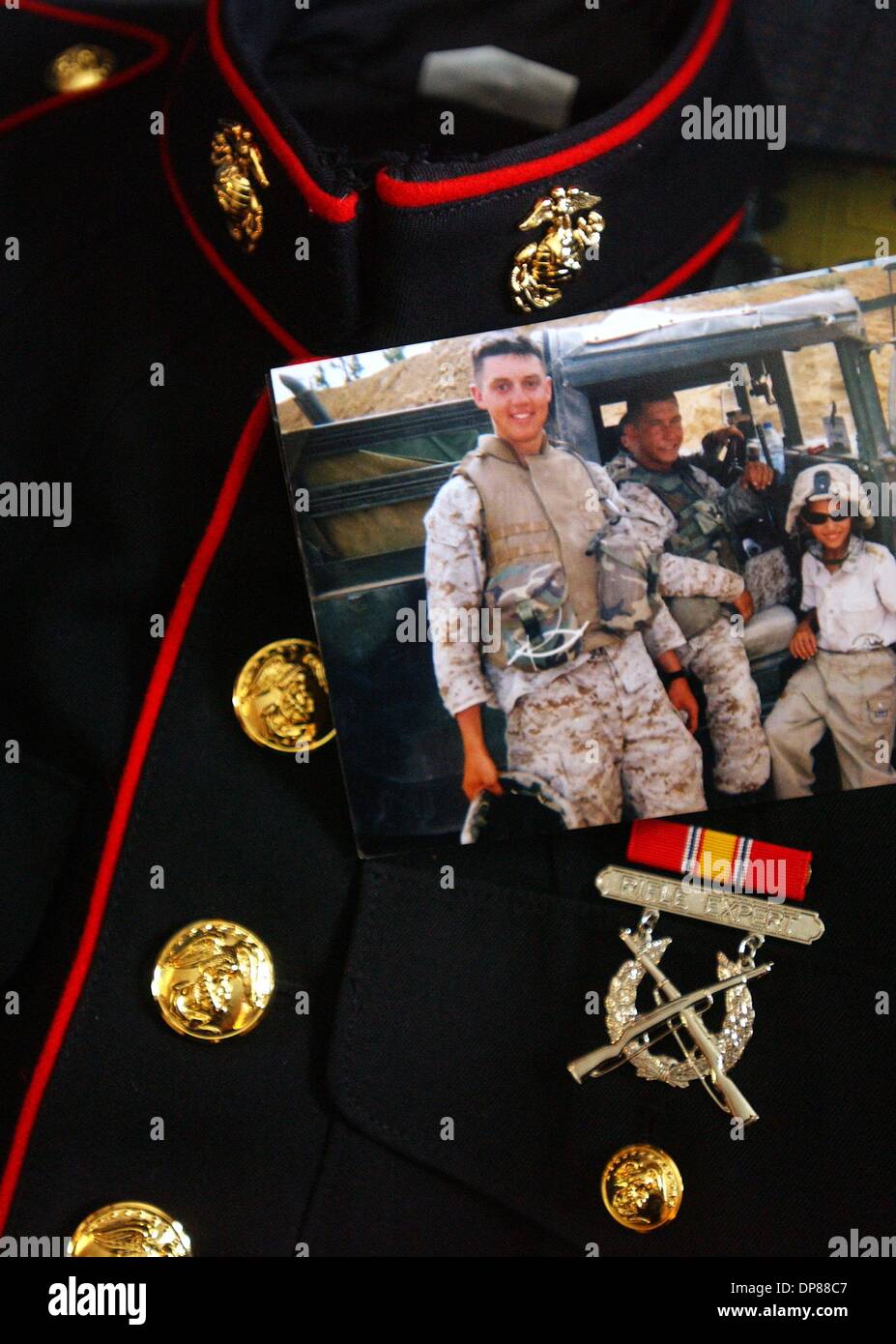 (Published 10/17/2004, A-1) NC KYLE 228579 x005 ............. 23 September, 2004, Nebraska ........... Months later Wain and Dixie Codner (cq) must decide what to do with their son's Marine dress blue uniform along with the many photos of their son taken while deployed to Iraq.  Kyle Codner was a U.S. Marine stationed at Camp Pendleton and deployed to Iraq was killed in back in May Stock Photo