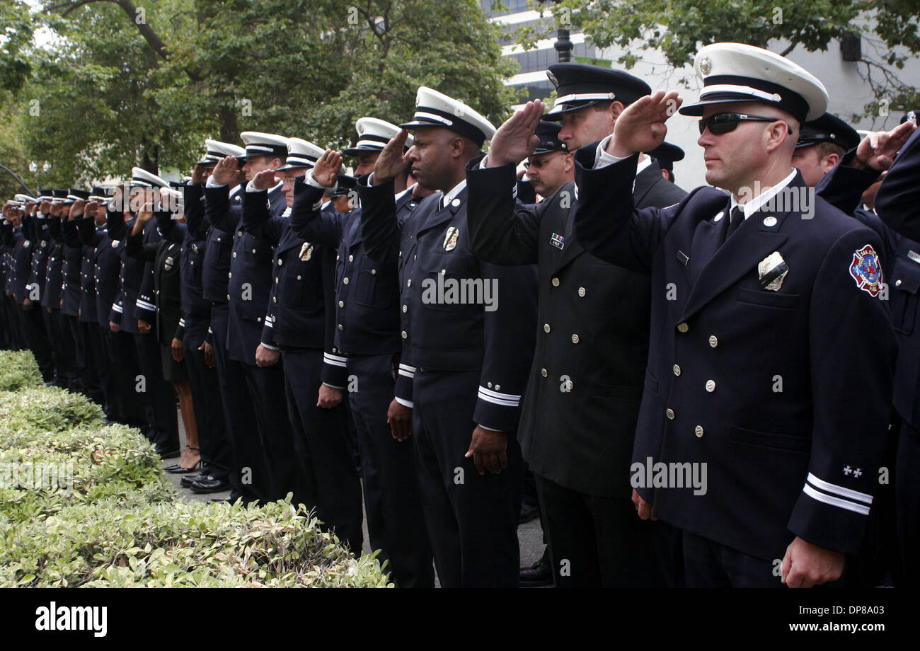 Firefighters, including Gerry Laird (right) of San Jose Fire Dept. and