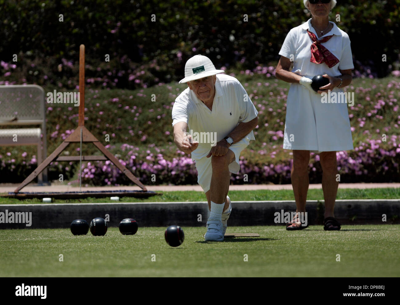 (Published 6/4/2006, B-3) June 2, 2006, San Diego, California, USA  ............ At the San Diego Lawn Bowling Club in Balboa Park, BILL HISCOCK (cq) takes his turn at rolling his bowl.  Competing with Bill is CHRISTINE LUDWIG.  Mandatory Credit: photo by Nelvin C. Cepeda/San Diego Union-Tribune/Zuma Press,. Copyright 2006 San Diego Union-Tribune Stock Photo