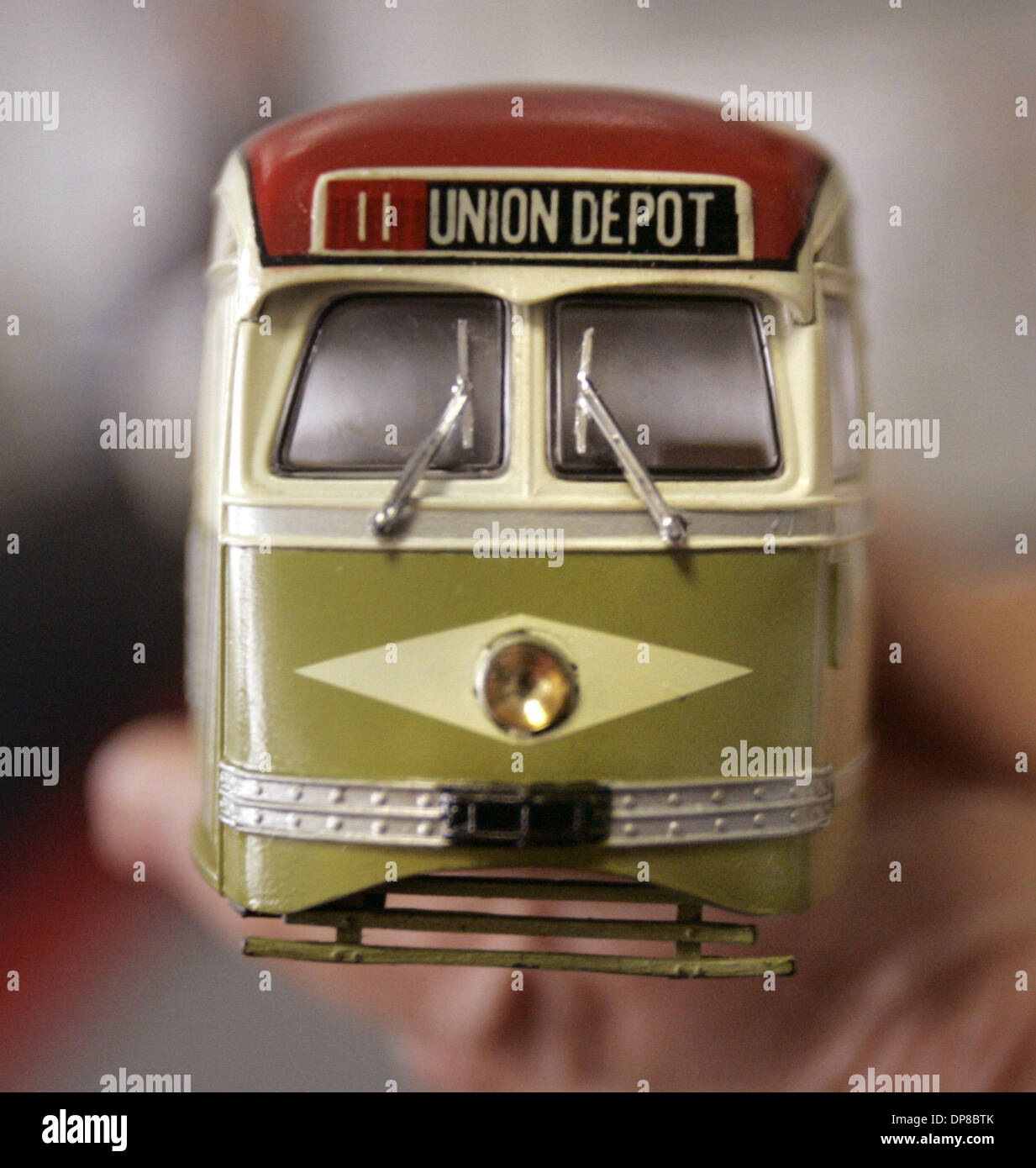 (Published 8/23/2005, B1) Harry Mathis, holds a model of an old