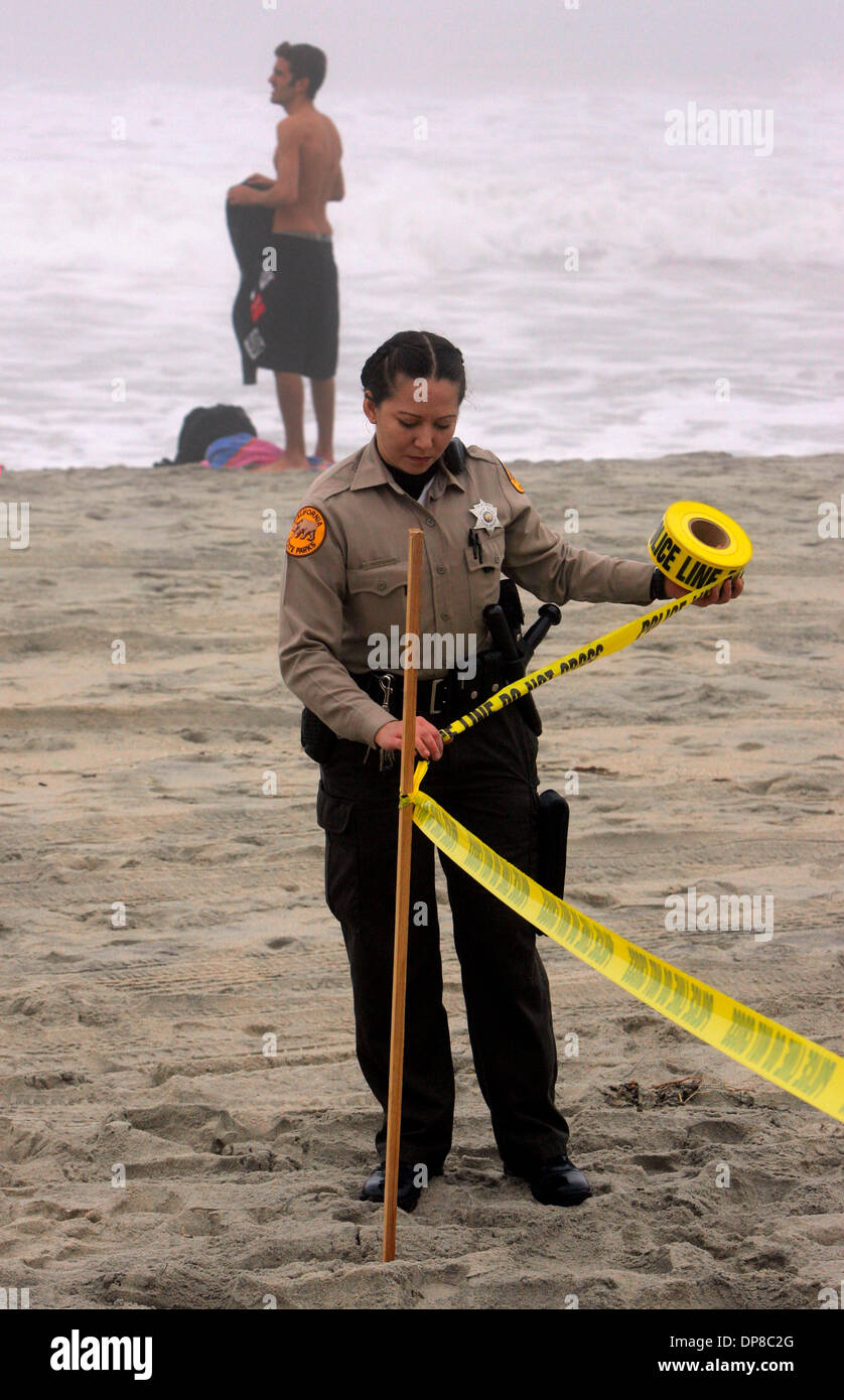 (published 12/23/2005, B-1:1,7) A State Park Ranger puts yellow tape ...