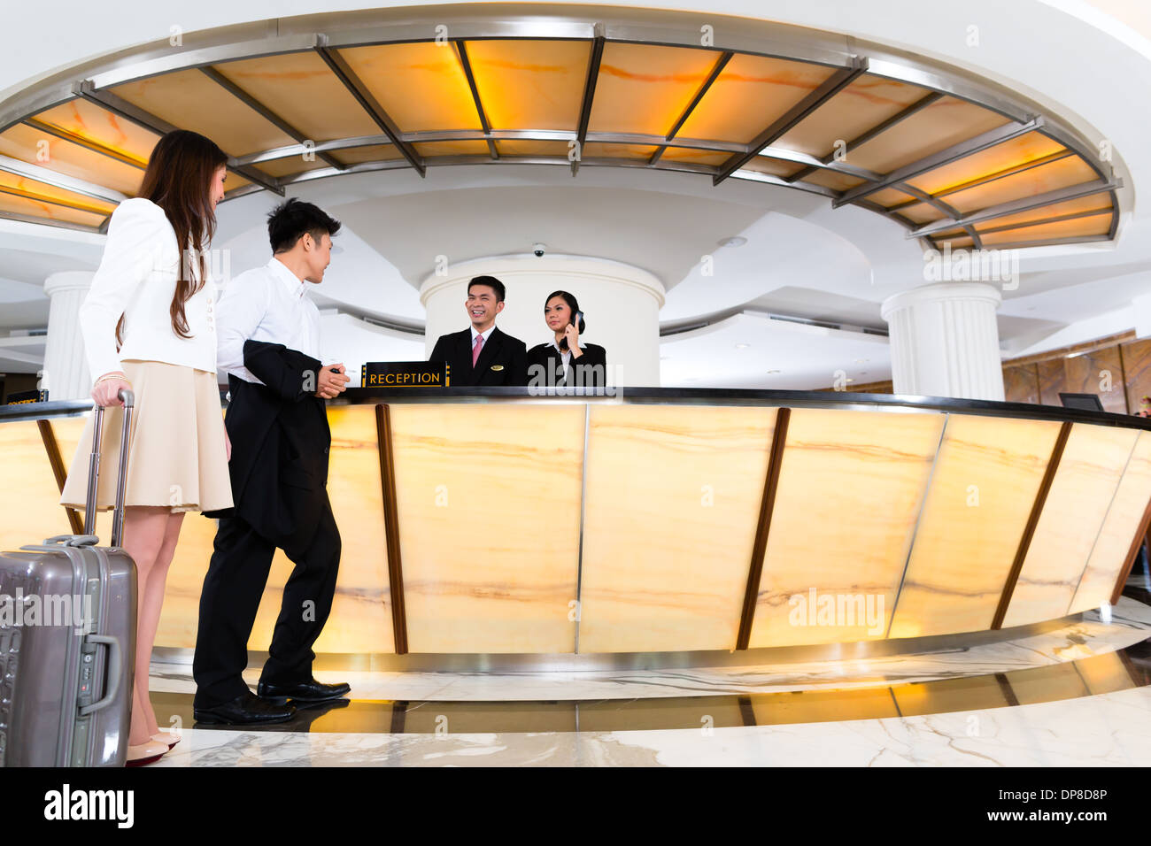 Chinese woman hotel receptionist hires stock photography and images