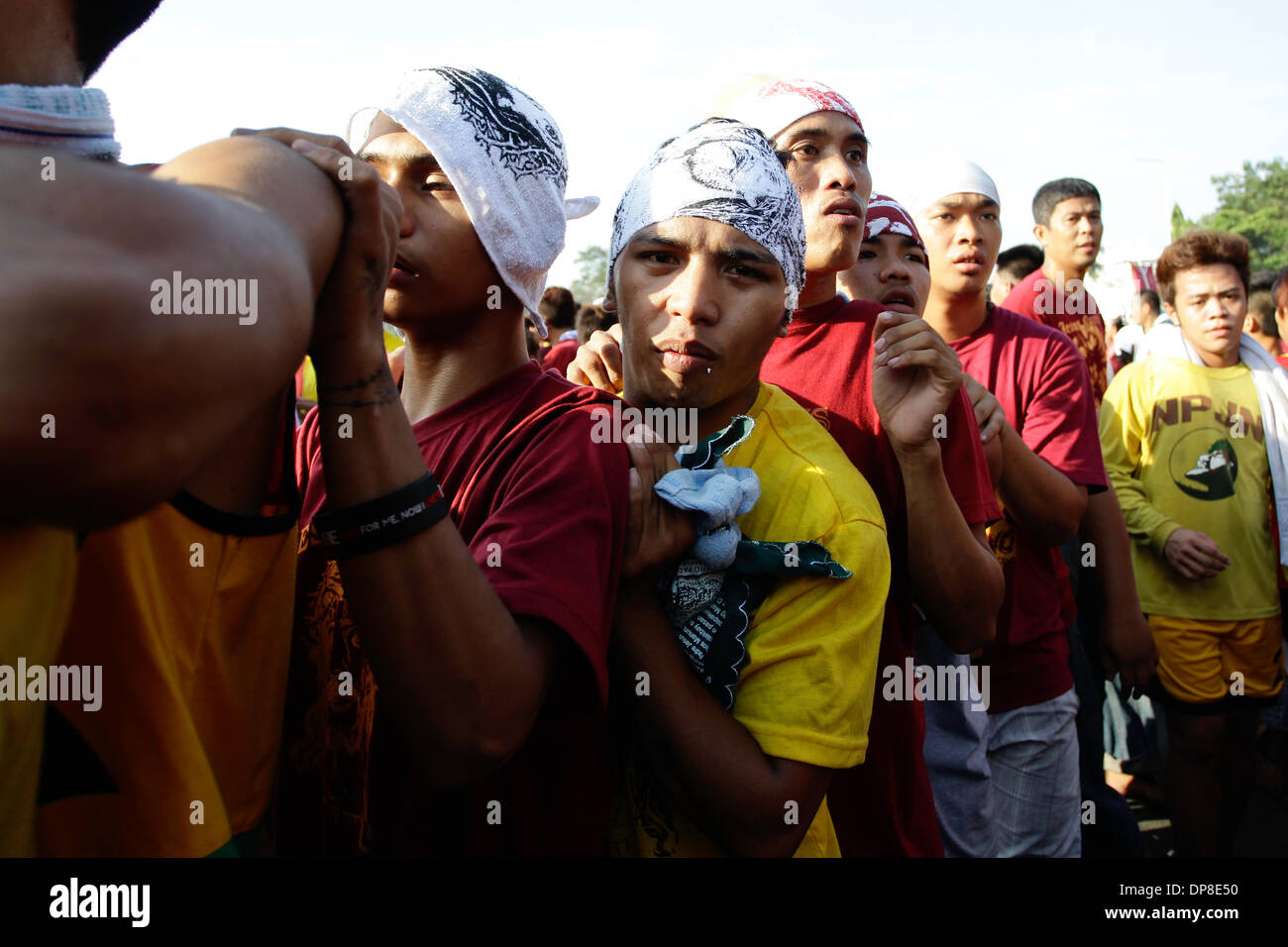 Manila, Philippines  . 09th Jan, 2014. Filipino devotees attempt to get close to the procession of Black Nazarene as it parades around Manila, Philippines on January 9, 2014. The Black Nazarene is believed to be miraculous by millions of Filipino Catholics. Photo by Mark Cristino Credit:  Mark Fredesjed Cristino/Alamy Live News Stock Photo