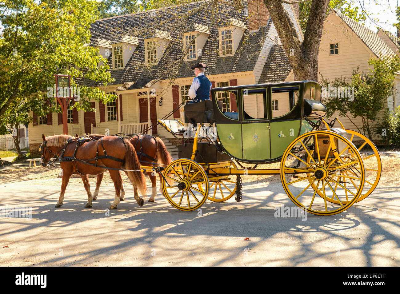 Colonial Williamsburg horse drawn carriage ride down Duke of Gloucester Street recreates 18th century transportation. Stock Photo