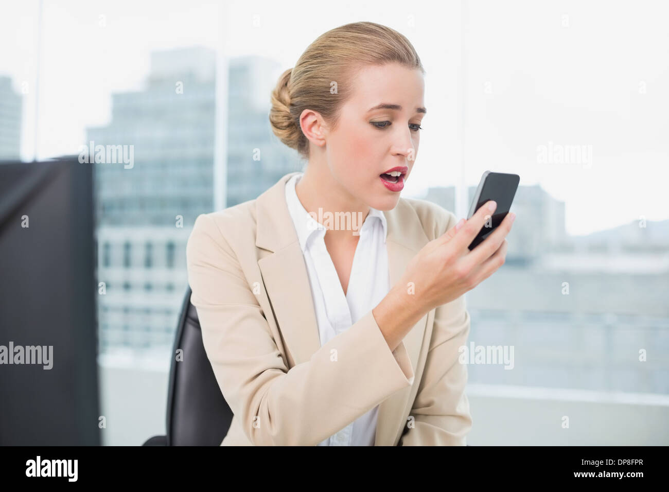 Angry blonde businesswoman on phone hi-res stock photography and images ...